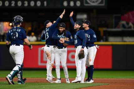 Sep 26, 2023; Seattle, Washington, USA; The Seattle Mariners celebrate defeating the Houston Astros at T-Mobile Park. Mandatory Credit: Steven Bisig-USA TODAY Sports