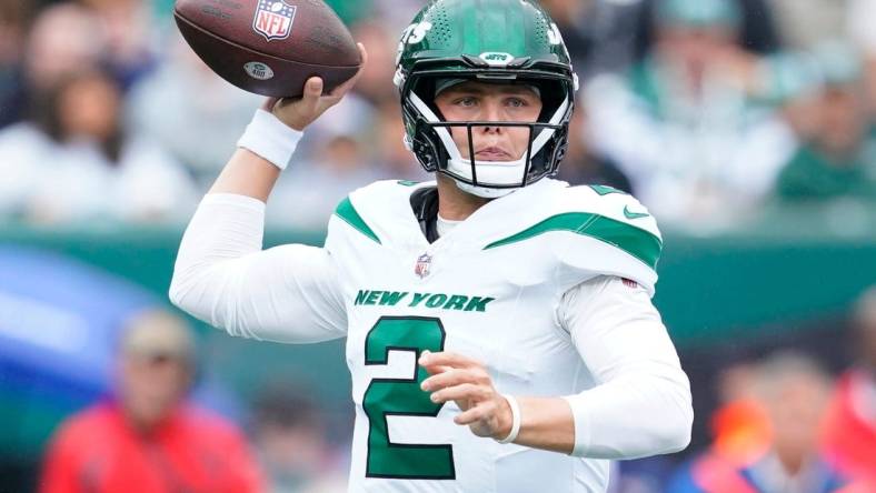 New York Jets quarterback Zach Wilson throws the ball against the New England Patriots in the first half of his team's loss at MetLife Stadium.