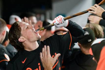 Sep 27, 2023; Baltimore, Maryland, USA;  Baltimore Orioles designated hitter Adley Rutschman (35) drinks from the homer hose after hitting a third inning homer run against the Washington Nationals at Oriole Park at Camden Yards. Mandatory Credit: Tommy Gilligan-USA TODAY Sports