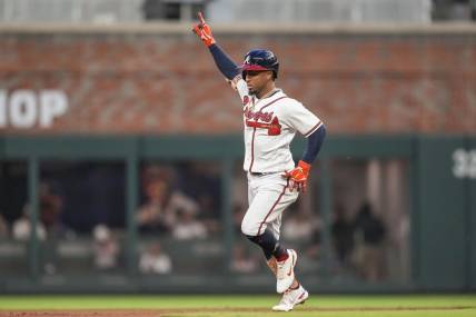 Sep 27, 2023; Cumberland, Georgia, USA; Atlanta Braves second baseman Ozzie Albies (1) reacts after hitting a home run against the Chicago Cubs during the first inning at Truist Park. Mandatory Credit: Dale Zanine-USA TODAY Sports