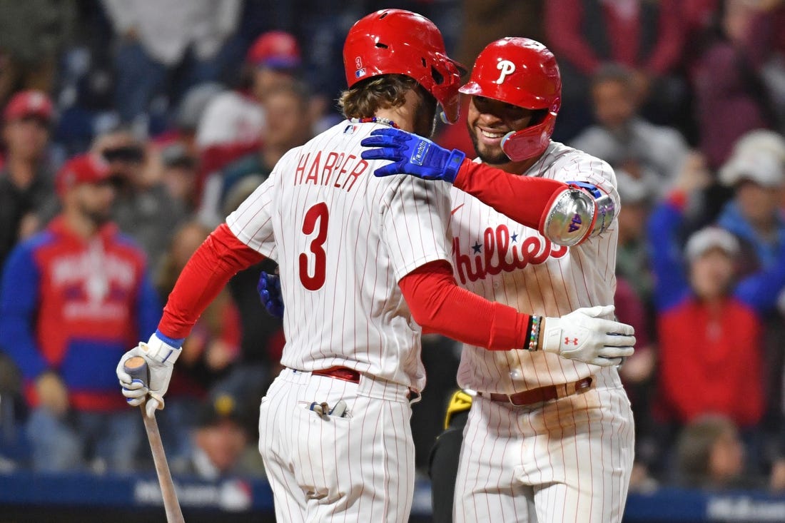 Sep 27, 2023; Philadelphia, Pennsylvania, USA; Philadelphia Phillies third baseman Edmundo Sosa (33) celebrates his home run with designated hitter Bryce Harper (3) during the fifth inning against the Pittsburgh Pirates at Citizens Bank Park. Mandatory Credit: Eric Hartline-USA TODAY Sports