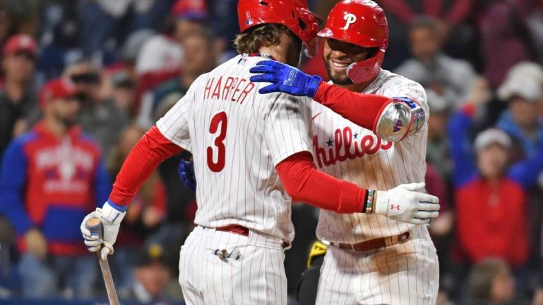 Sep 27, 2023; Philadelphia, Pennsylvania, USA; Philadelphia Phillies third baseman Edmundo Sosa (33) celebrates his home run with designated hitter Bryce Harper (3) during the fifth inning against the Pittsburgh Pirates at Citizens Bank Park. Mandatory Credit: Eric Hartline-USA TODAY Sports