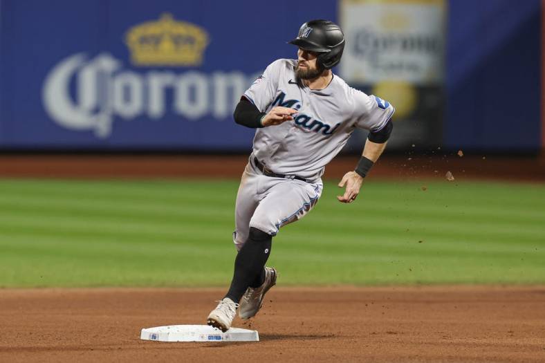 Sep 27, 2023; New York, NY, USA;  Miami Marlins shortstop Jon Berti (5) rounds second base during a single by first baseman Josh Bell (not pictured) during the fifth inning against the New York Mets at Citi Field.  Mandatory Credit: Vincent Carchietta-USA TODAY Sports