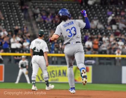 Sep 27, 2023; Denver, Colorado, USA; Los Angeles Dodgers center fielder James Outman (33) pumps his fist after hitting a 382ft home run off of Colorado Rockies starting pitcher Noah Davis (63) during the third inning at Coors Field. Mandatory Credit: John Leyba-USA TODAY Sports