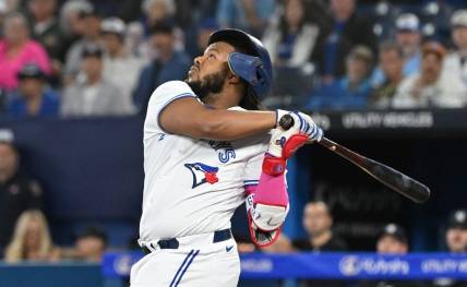 Sep 27, 2023; Toronto, Ontario, CAN;  Toronto Blue Jays first baseman Vladimir Guerrero Jr. (27) loses his batting helmet as he pops out against the New York Yankees in the first inning at Rogers Centre. Mandatory Credit: Dan Hamilton-USA TODAY Sports
