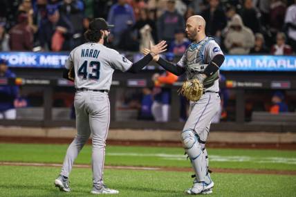 Sep 27, 2023; New York, NY, USA; Miami Marlins relief pitcher Andrew Nardi (43) celebrates with catcher Jacob Stallings (58) after defeating the New York Mets at Citi Field.  Mandatory Credit: Vincent Carchietta-USA TODAY Sports