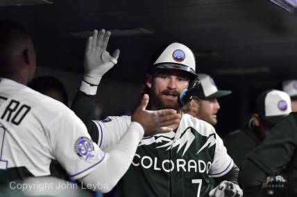 Sep 27, 2023; Denver, Colorado, USA; Colorado Rockies second baseman Brendan Rodgers (7) gets a high five from Elehuris Montero after his home run during the sixth inning against the Los Angeles Dodgers at Coors Field. Mandatory Credit: John Leyba-USA TODAY Sports