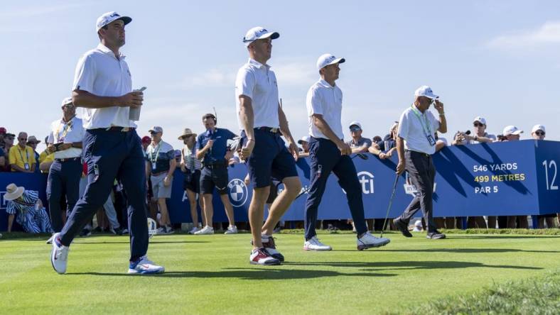 Sep 28, 2023; Rome, ITA; From left, Team USA golfers Scottie Scheffler, Justin Thomas, Jordan Spieth and Thomas    dad, Mike Thomas, walk the 12th hole during a practice day for the Ryder Cup golf competition at Marco Simone Golf and Country Club. Mandatory Credit: Adam Cairns-USA TODAY Sports