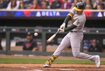 Sep 28, 2023; Minneapolis, Minnesota, USA; Oakland Athletics outfielder J.J. Bleday (33) hits a single against the Minnesota Twins during the second inning at Target Field. Mandatory Credit: Nick Wosika-USA TODAY Sports