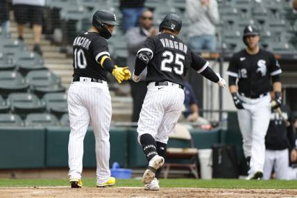 Sep 28, 2023; Chicago, Illinois, USA; Chicago White Sox first baseman Andrew Vaughn (25) celebrates with third baseman Yoan Moncada (10) after hitting a two-run home run against the Arizona Diamondbacks during the second inning at Guaranteed Rate Field. Mandatory Credit: Kamil Krzaczynski-USA TODAY Sports