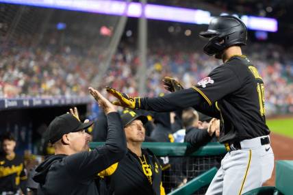 Sep 28, 2023; Philadelphia, Pennsylvania, USA; Pittsburgh Pirates third baseman Jared Triolo (19) is congratulated after scoring against the Philadelphia Phillies during the fifth inning at Citizens Bank Park. Mandatory Credit: Bill Streicher-USA TODAY Sports