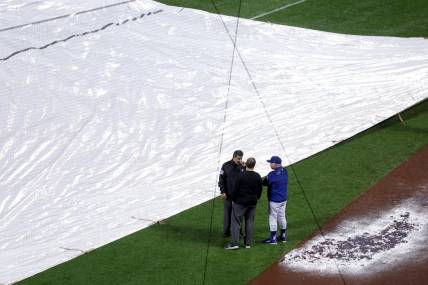 Sep 28, 2023; New York City, New York, USA; New York Mets manager Buck Showalter (11) talks to officials during a rain delay during the ninth inning against the Miami Marlins at Citi Field. Mandatory Credit: Brad Penner-USA TODAY Sports