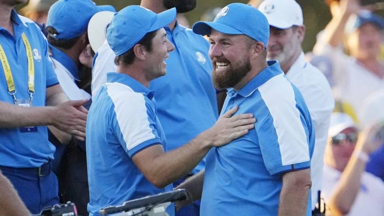 Sep 29, 2023; Rome, ITA; Team Europe golfer Viktor Hovland and golfer Tyrrell Hatton celebrate on the 18th hole during day one fourballs round for the 44th Ryder Cup golf competition at Marco Simone Golf and Country Club. Mandatory Credit: Adam Cairns-USA TODAY Sports