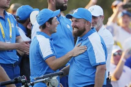 Sep 29, 2023; Rome, ITA; Team Europe golfer Viktor Hovland and golfer Tyrrell Hatton celebrate on the 18th hole during day one fourballs round for the 44th Ryder Cup golf competition at Marco Simone Golf and Country Club. Mandatory Credit: Adam Cairns-USA TODAY Sports