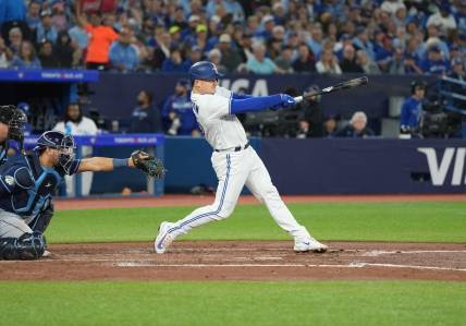 Sep 29, 2023; Toronto, Ontario, CAN; Toronto Blue Jays third baseman Matt Chapman (26) hits a double against the Tampa Bay Rays during the third inning at Rogers Centre. Mandatory Credit: Nick Turchiaro-USA TODAY Sports
