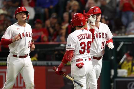 Sep 29, 2023; Anaheim, California, USA;  Los Angeles Angels center fielder Mickey Moniak (16) is greeted by third baseman Michael Stefanic (38) after hitting a home run during the fifth inning against the Oakland Athletics at Angel Stadium. Mandatory Credit: Kiyoshi Mio-USA TODAY Sports