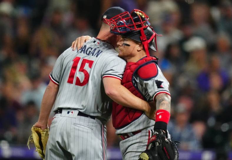 Sep 29, 2023; Denver, Colorado, USA; Minnesota Twins relief pitcher Emilio Pagan (15) and catcher Christian Vazquez (8) celebrate defeating the Colorado Rockies at Coors Field. Mandatory Credit: Ron Chenoy-USA TODAY Sports