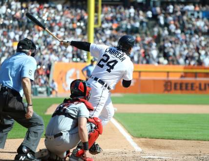 Detroit Tigers designated hitter Miguel Cabrera (24) doubles against Cleveland Guardians starting pitcher Triston McKenzie (24) during fourth-inning action at Comerica Park in Detroit on Saturday, Sept. 30, 2023.