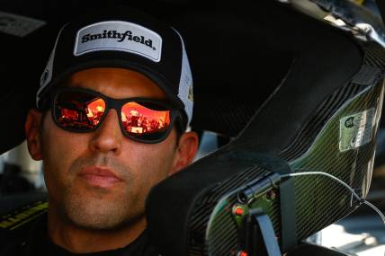 Sep 30, 2023; Talladega, Alabama, USA; NASCAR Cup Series driver Aric Almirola (10) looks on during qualifying for the YellaWood 500 at Talladega Superspeedway. Mandatory Credit: Douglas DeFelice-USA TODAY Sports