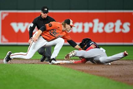 Sep 30, 2023; Baltimore, Maryland, USA; Baltimore Orioles third baseman Gunnar Henderson (2) tags Boston Red Sox designated hitter Justin Turner (2) out on a third inning steal attempt at Oriole Park at Camden Yards. Mandatory Credit: Tommy Gilligan-USA TODAY Sports