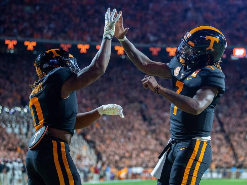 Tennessee running back Jaylen Wright (0) and quarterback Joe Milton III (7) celebrate Wright's touchdown during an NCAA college football game between Tennessee and South Carolina in Knoxville, Tenn., on Saturday, Sept. 30, 2023.