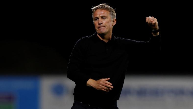 Wrexham manager Phil Parkinson celebrates winning a penalty shootout against Wigan Athletic at the Racecourse Ground in Wrexham, Wales, Britain on Aug. 8, 2023. (Action Images/Jason Cairnduff)