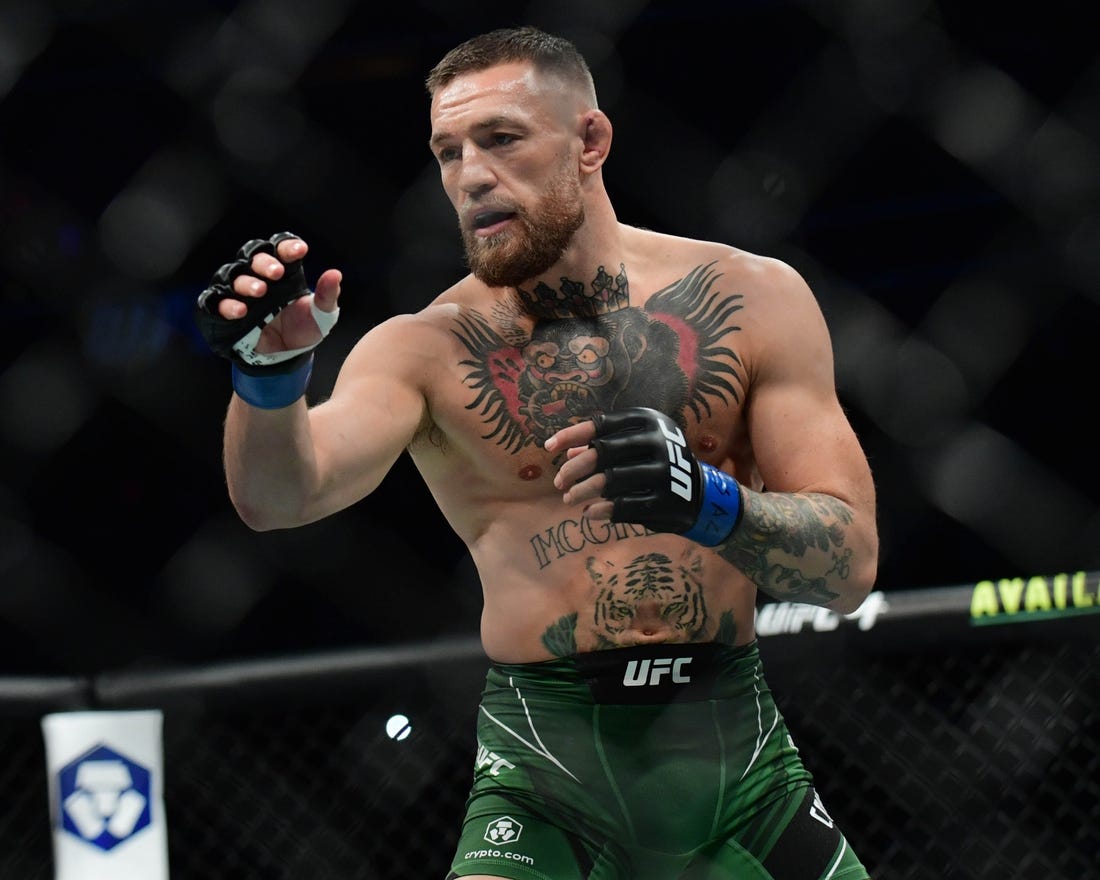 Jul 10, 2021; Las Vegas, Nevada, USA; Conor McGregor fights Dustin Poirier during UFC 264 at T-Mobile Arena. Mandatory Credit: Gary A. Vasquez-USA TODAY Sports