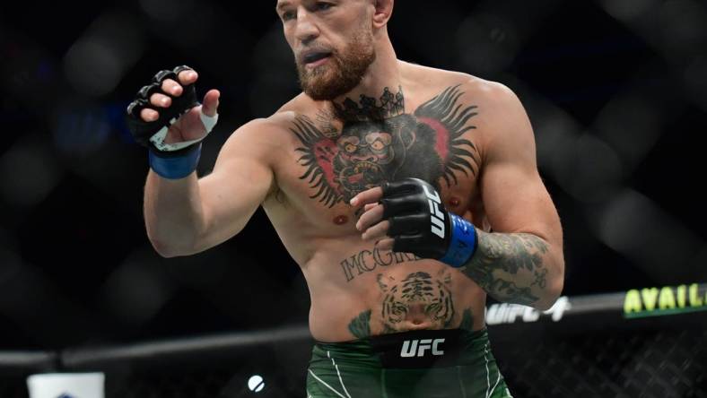 Jul 10, 2021; Las Vegas, Nevada, USA; Conor McGregor fights Dustin Poirier during UFC 264 at T-Mobile Arena. Mandatory Credit: Gary A. Vasquez-USA TODAY Sports