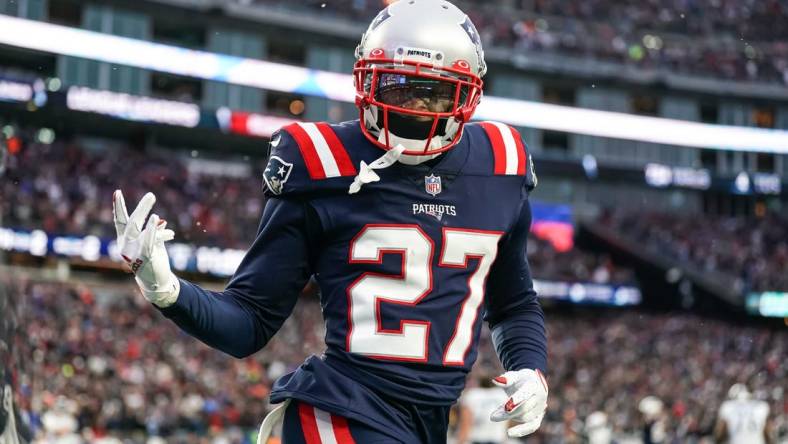 Nov 28, 2021; Foxborough, Massachusetts, USA; New England Patriots cornerback J.C. Jackson (27) reacts after intercepting a pass in the Tennessee Titans end zone in the second half at Gillette Stadium. Mandatory Credit: David Butler II-USA TODAY Sports