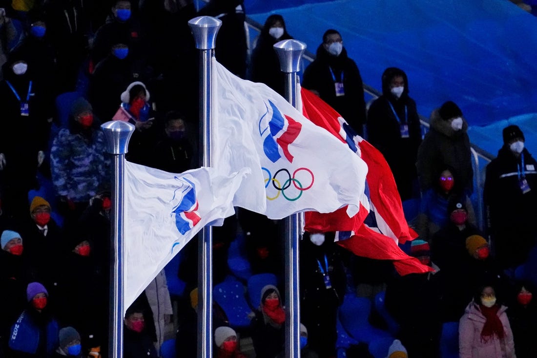 Feb 20, 2022; Beijing, CHINA; Two Russian Olympic Committee flags and the flag of Norway are displayed during the medal ceremony for the cross-country skiing men's 50km mass start during the closing ceremony for the Beijing 2022 Olympic Winter Games at Beijing National Stadium. Mandatory Credit: George Walker IV-USA TODAY Sports