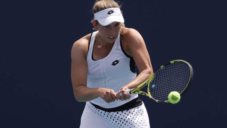 Mar 25, 2022; Miami Gardens, FL, USA; Elise Mertens (BEL) hits a backhand against Linda Fruhvirtova (CZE) (not pictured) in a second round women's match in the Miami Open at Hard Rock Stadium. Mandatory Credit: Geoff Burke-USA TODAY Sports