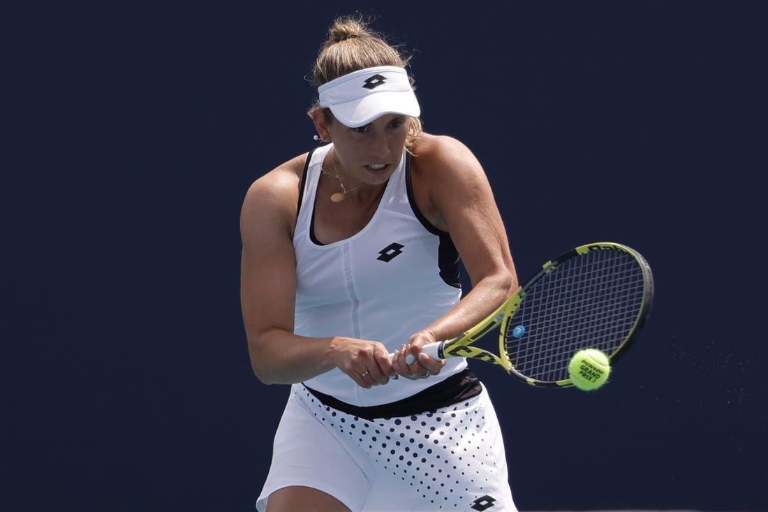 Mar 25, 2022; Miami Gardens, FL, USA; Elise Mertens (BEL) hits a backhand against Linda Fruhvirtova (CZE) (not pictured) in a second round women's match in the Miami Open at Hard Rock Stadium. Mandatory Credit: Geoff Burke-USA TODAY Sports