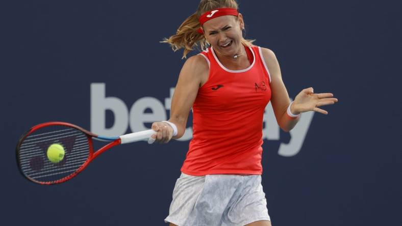 Mar 25, 2022; Miami Gardens, FL, USA; Marie Bouzkova (CZE) hits a forehand against Paula Badosa (ESP) (not pictured) in a second round women's match in the Miami Open at Hard Rock Stadium. Mandatory Credit: Geoff Burke-USA TODAY Sports