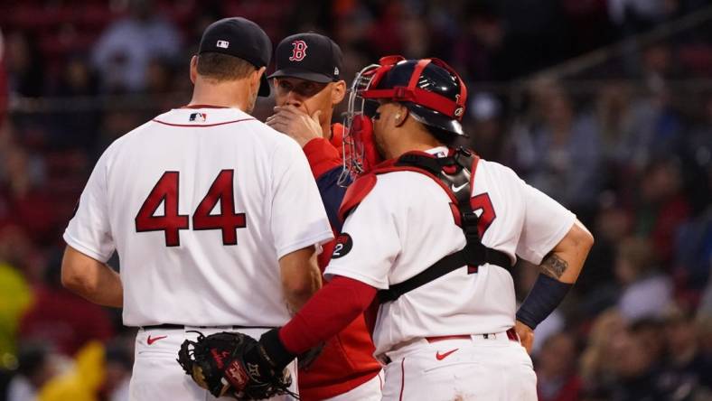 May 19, 2022; Boston, Massachusetts, USA; Boston Red Sox pitching coach Dave Bush (58) talks with starting pitcher Rich Hill (44) against the Seattle Mariners in the second inning at Fenway Park. Mandatory Credit: David Butler II-USA TODAY Sports