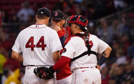 May 19, 2022; Boston, Massachusetts, USA; Boston Red Sox pitching coach Dave Bush (58) talks with starting pitcher Rich Hill (44) against the Seattle Mariners in the second inning at Fenway Park. Mandatory Credit: David Butler II-USA TODAY Sports