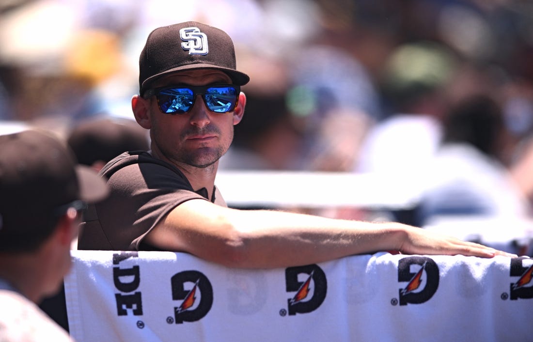 Jun 12, 2022; San Diego, California, USA; San Diego Padres acting manager Ryan Flaherty looks on from the dugout during the third inning against the Colorado Rockies at Petco Park. Mandatory Credit: Orlando Ramirez-USA TODAY Sports