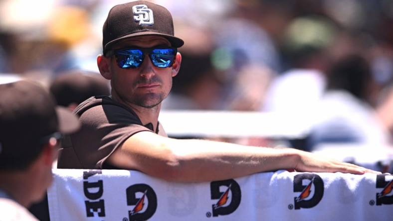 Jun 12, 2022; San Diego, California, USA; San Diego Padres acting manager Ryan Flaherty looks on from the dugout during the third inning against the Colorado Rockies at Petco Park. Mandatory Credit: Orlando Ramirez-USA TODAY Sports