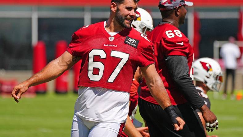 June 15, 2022; Tempe, Arizona; USA; Cardinals offensive lineman Justin Pugh warms up during camp at the Tempe Training facility.

Nfl Cardinals Mandatory Camp At Arizona Cardinals