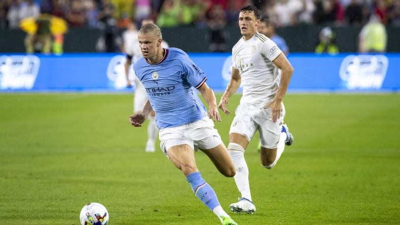 July 23, 2022; Green Bay, WI, USA; Manchester City forward Erling Haaland (9) runs the ball during the exhibition match against FC Bayern Munich on Saturday, July 23, 2022 at Lambeau Field in Green Bay, Wis. Mandatory Credit: Samantha Madar-USA TODAY Sports