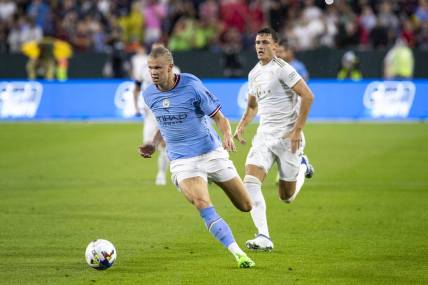 July 23, 2022; Green Bay, WI, USA; Manchester City forward Erling Haaland (9) runs the ball during the exhibition match against FC Bayern Munich on Saturday, July 23, 2022 at Lambeau Field in Green Bay, Wis. Mandatory Credit: Samantha Madar-USA TODAY Sports