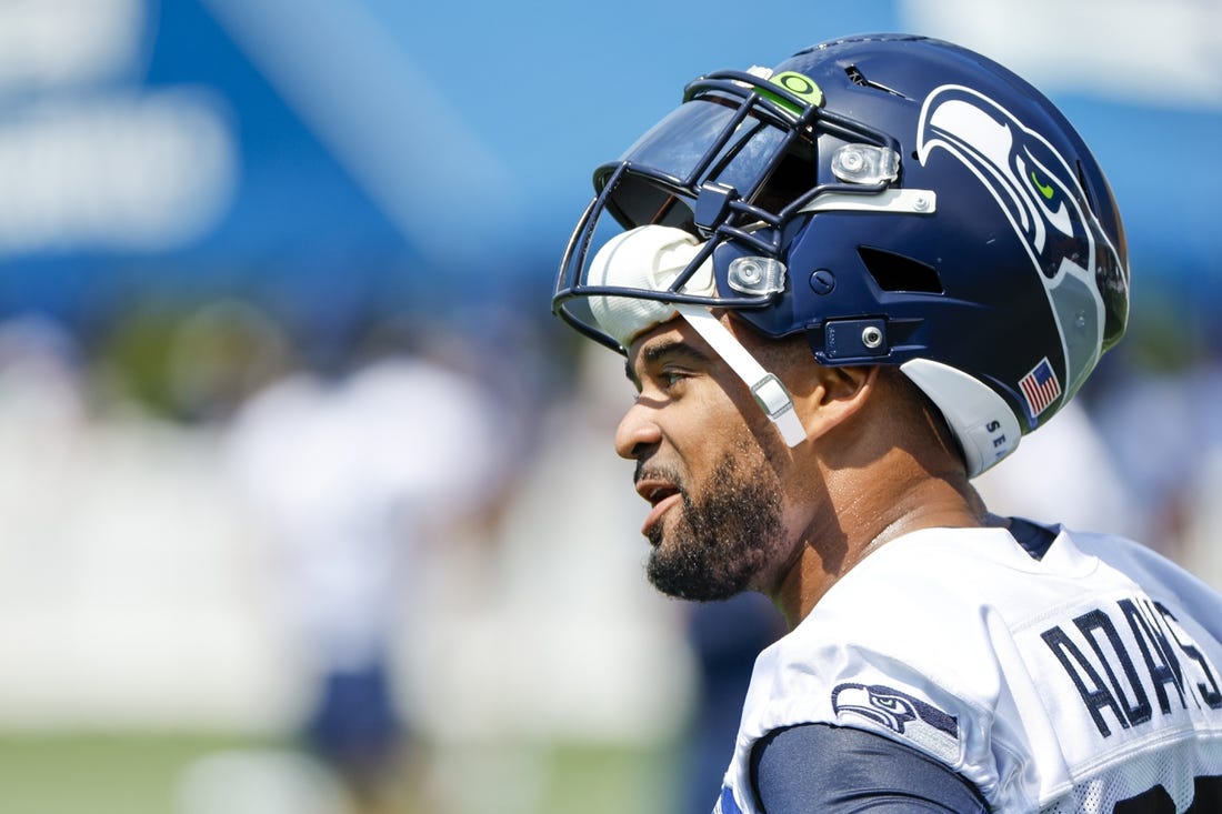 Jul 27, 2022; Renton, WA, USA; Seattle Seahawks safety Jamal Adams (33) talks with a teammate during training camp practice at Virginia Mason Athletic Center. Mandatory Credit: Joe Nicholson-USA TODAY Sports