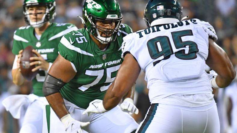 Aug 12, 2022; Philadelphia, Pennsylvania, USA; New York Jets lineman Alijah Vera-Tucker (75) blocks Philadelphia Eagles defensive tackle Marlon Tuipulotu (95) at Lincoln Financial Field. Mandatory Credit: Eric Hartline-USA TODAY Sports