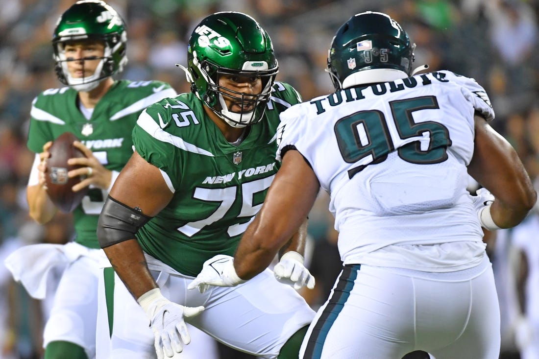 Aug 12, 2022; Philadelphia, Pennsylvania, USA; New York Jets lineman Alijah Vera-Tucker (75) blocks Philadelphia Eagles defensive tackle Marlon Tuipulotu (95) at Lincoln Financial Field. Mandatory Credit: Eric Hartline-USA TODAY Sports