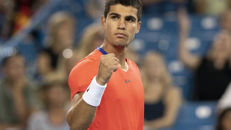 Aug 19, 2022; Cincinnati, OH, USA; Carlos Alcaraz (ESP) reacts to a point during his match against Cameron Norrie (GBR) at the Western & Southern Open at the Lindner Family Tennis Center. Mandatory Credit: Susan Mullane-USA TODAY Sports