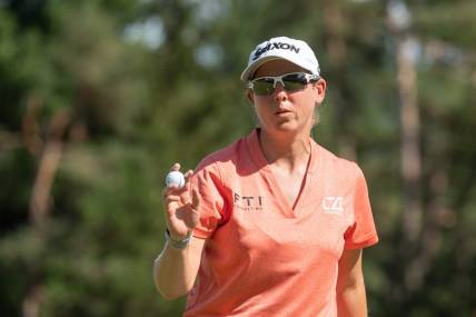 Aug 28, 2022; Ottawa, Ontario, CAN; Ashleigh Buhai from South Africa wraps up the 18th hole in the final round of the CP Women's Open golf tournament. Mandatory Credit: Marc DesRosiers-USA TODAY Sports