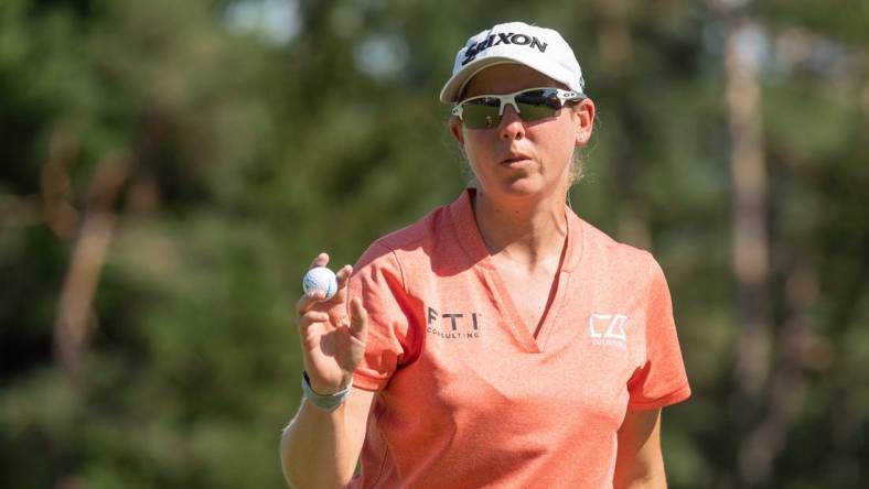 Aug 28, 2022; Ottawa, Ontario, CAN; Ashleigh Buhai from South Africa wraps up the 18th hole in the final round of the CP Women's Open golf tournament. Mandatory Credit: Marc DesRosiers-USA TODAY Sports