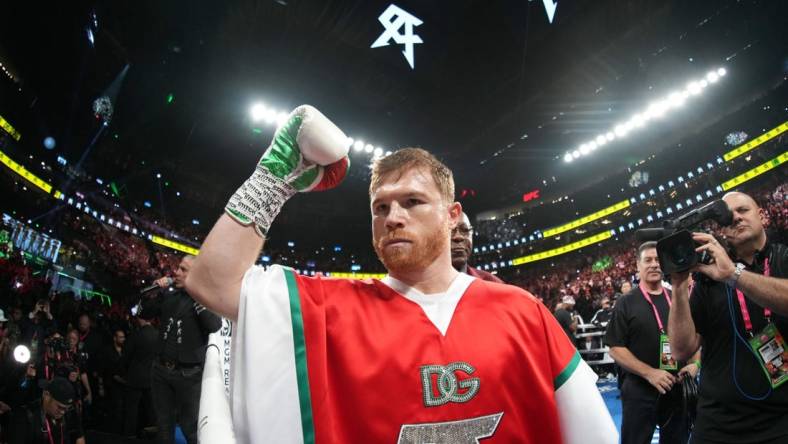 Sep 17, 2022; Las Vegas, Nevada, USA; Canelo Alvarez (red trunks) and Gennadiy Golovkin (white trunks) box during a middleweight championship bout at T-Mobile Arena. Mandatory Credit: Joe Camporeale-USA TODAY Sports