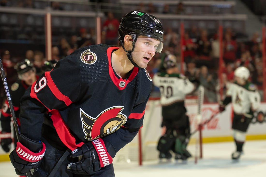 Oct 22, 2022; Ottawa, Ontario, CAN; Ottawa Senators center Josh Norris (9 skates back to the bench after scoring  in the first period against the Arizona Coyotes at the Canadian Tire Centre. Mandatory Credit: Marc DesRosiers-USA TODAY Sports