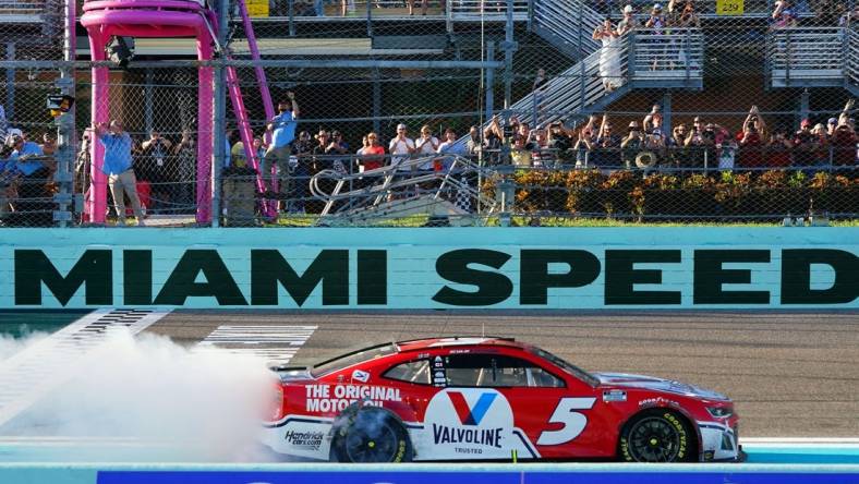 Oct 23, 2022; Homestead, Florida, USA; NASCAR Cup Series driver Kyle Larson (5) celebrates winning the Dixie Vodka 400 at Homestead-Miami Speedway. Mandatory Credit: John David Mercer-USA TODAY Sports