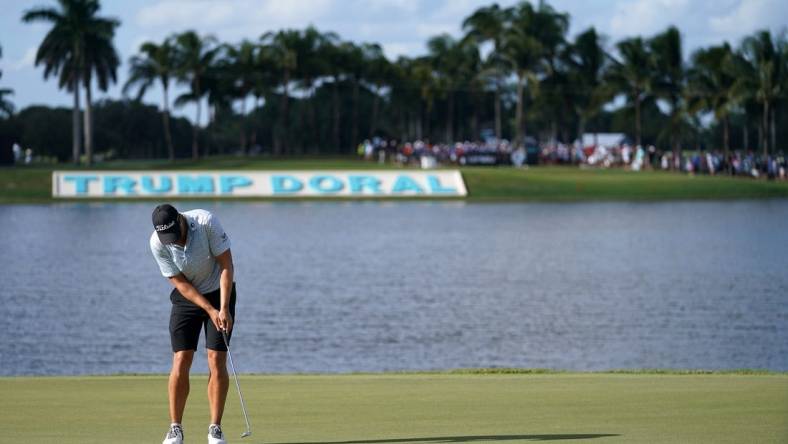 Oct 30, 2022; Miami, Florida, USA; Peter Uihlein putts on the 18th green during the final round of the season finale of the LIV Golf series at Trump National Doral. Mandatory Credit: Jasen Vinlove-USA TODAY Sports